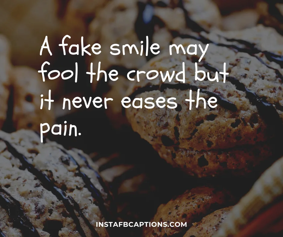A fake smile may fool the crowd but it never eases the pain  - Fake Smile Captions - [New] Short Smile Captions for Instagram in 2024