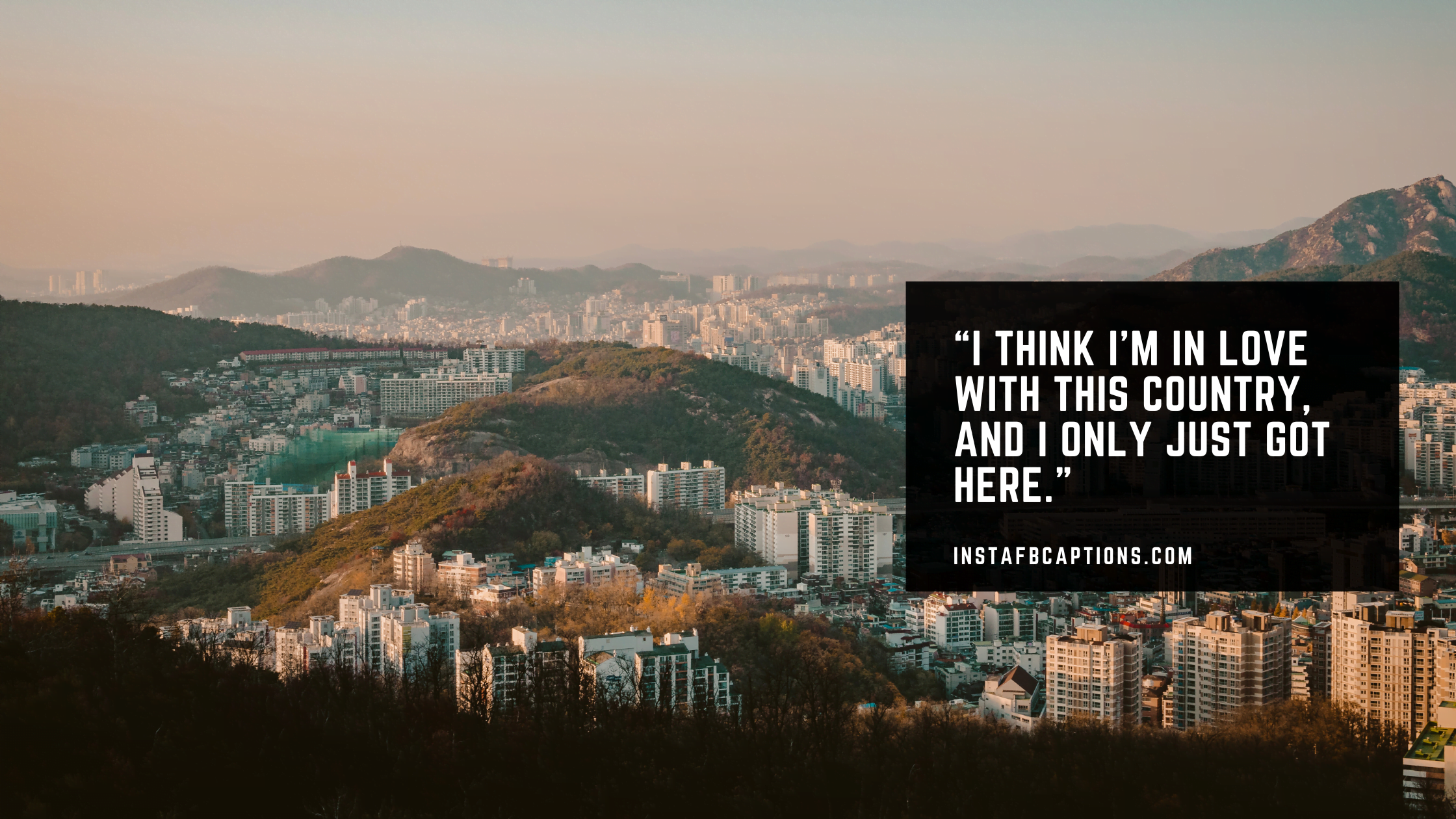 A unknown city view of South Korea and a caption written - “I think I’m in love with this country, and I only just got here.”   - South Korea Seoul Tower Captions - 70+ Spectacular South Korea Captions &#8211; For Your Trip In 2023